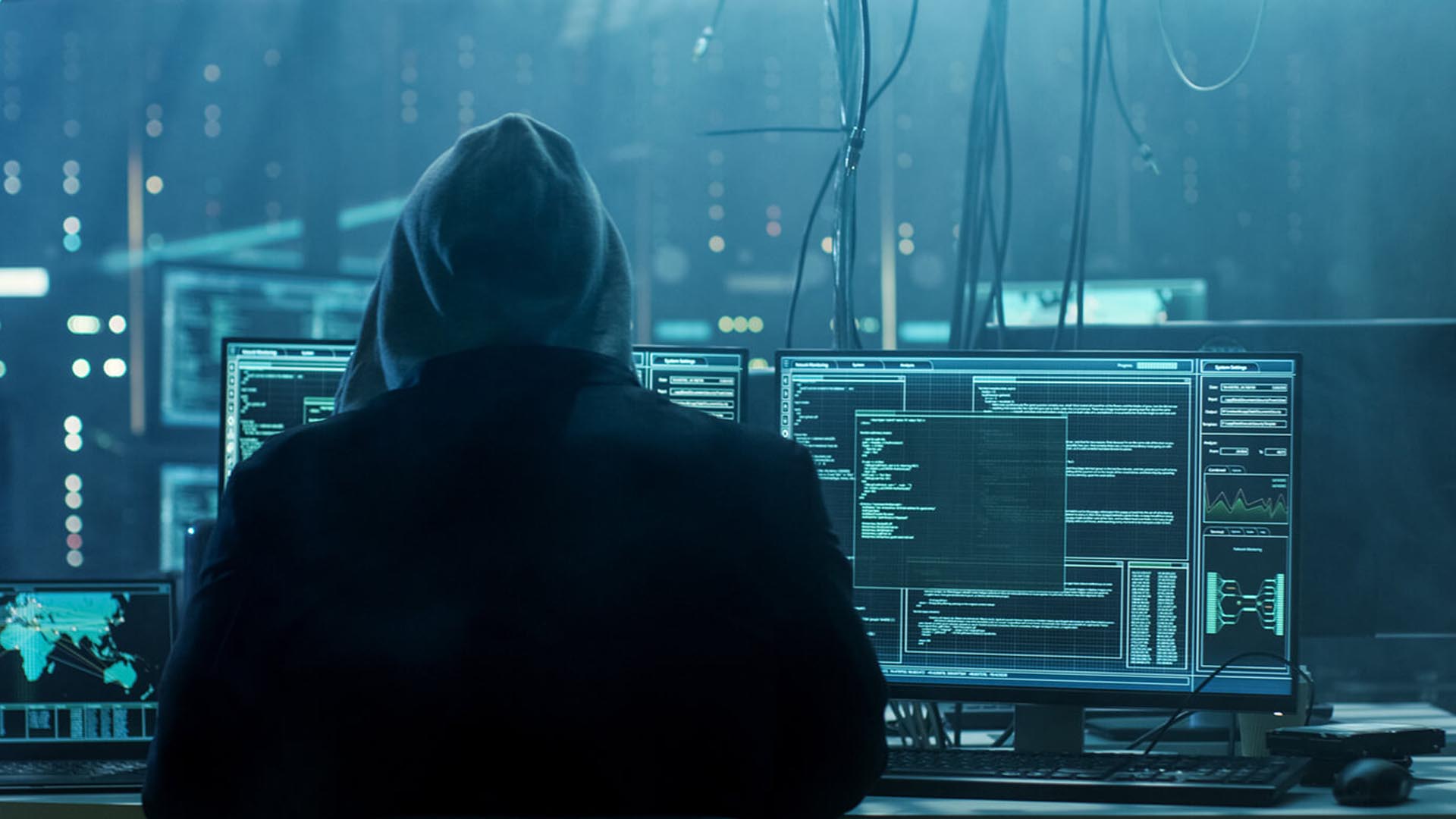 photo of a man in a large dark computer server room