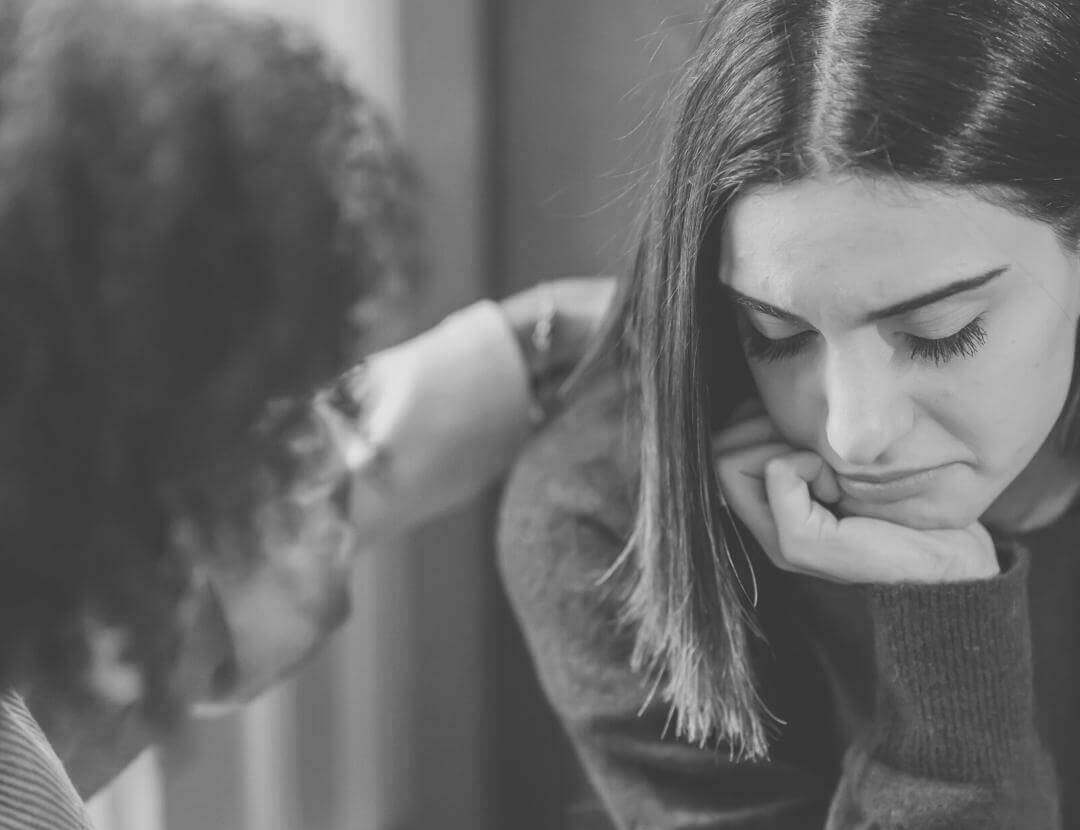 a guy consoling his girlfriend