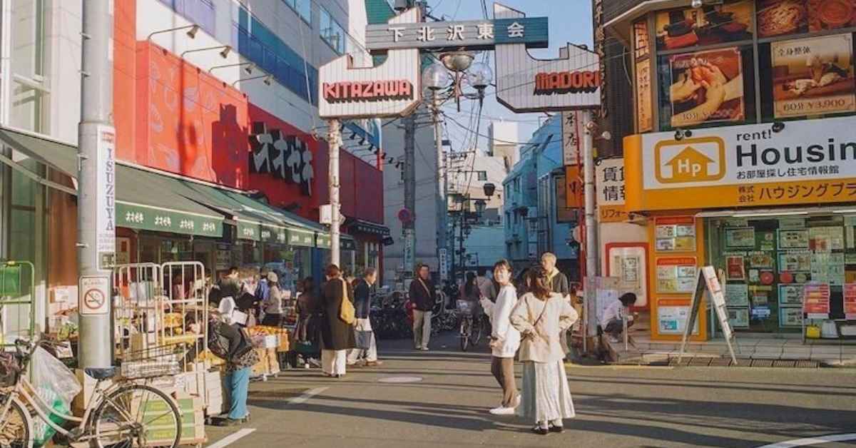 woman standing in busy road in japan