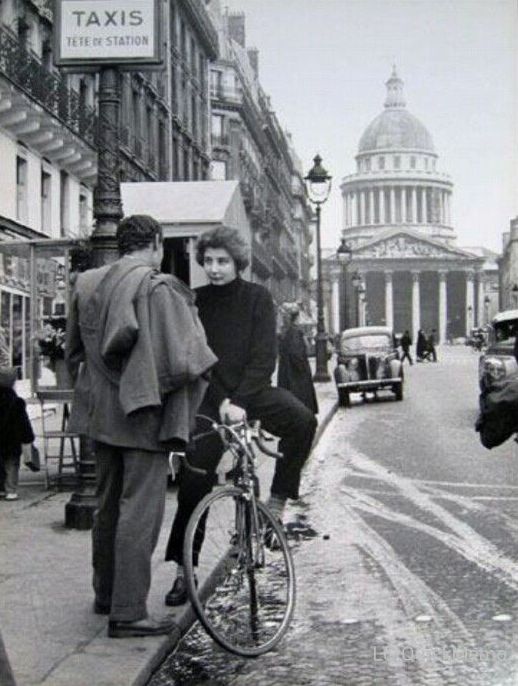 man and woman talking in street