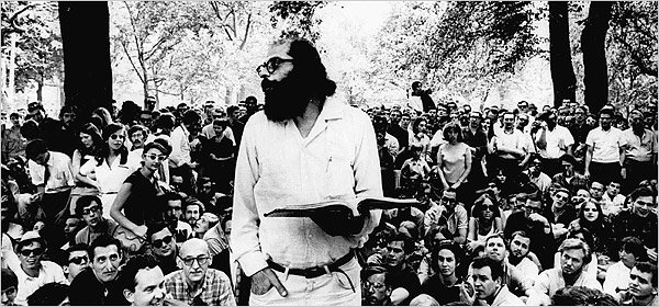 Allen Ginsberg reciting his poems to a crowd in a park