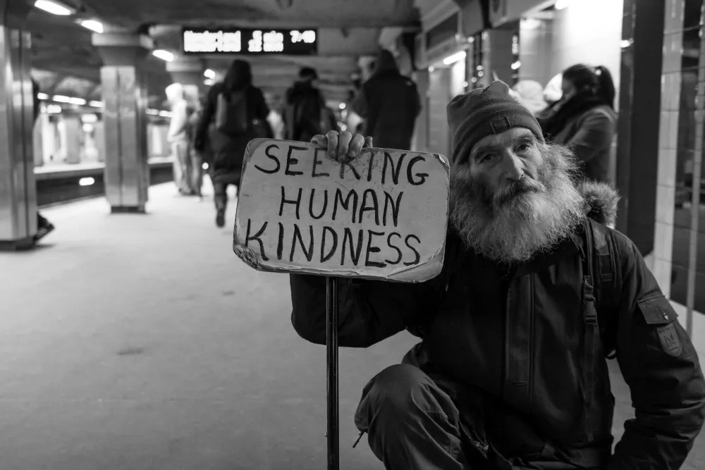 homeless man asking for human kindness