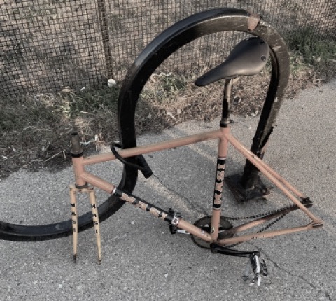 photo of bike frame after having pieces stolen from it while it was locked up