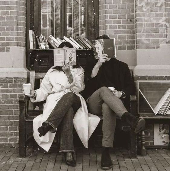 guy and girl reading books side by side